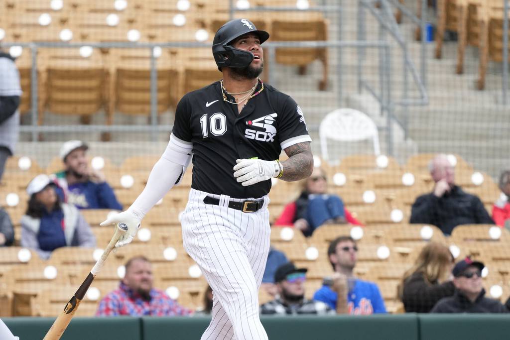 White Sox outfielder/designated hitter Yoan Moncada watches the flight of his fly ball during the second inning of a Cactus League game against the Guardians on March 1 in Glendale, Ariz. 