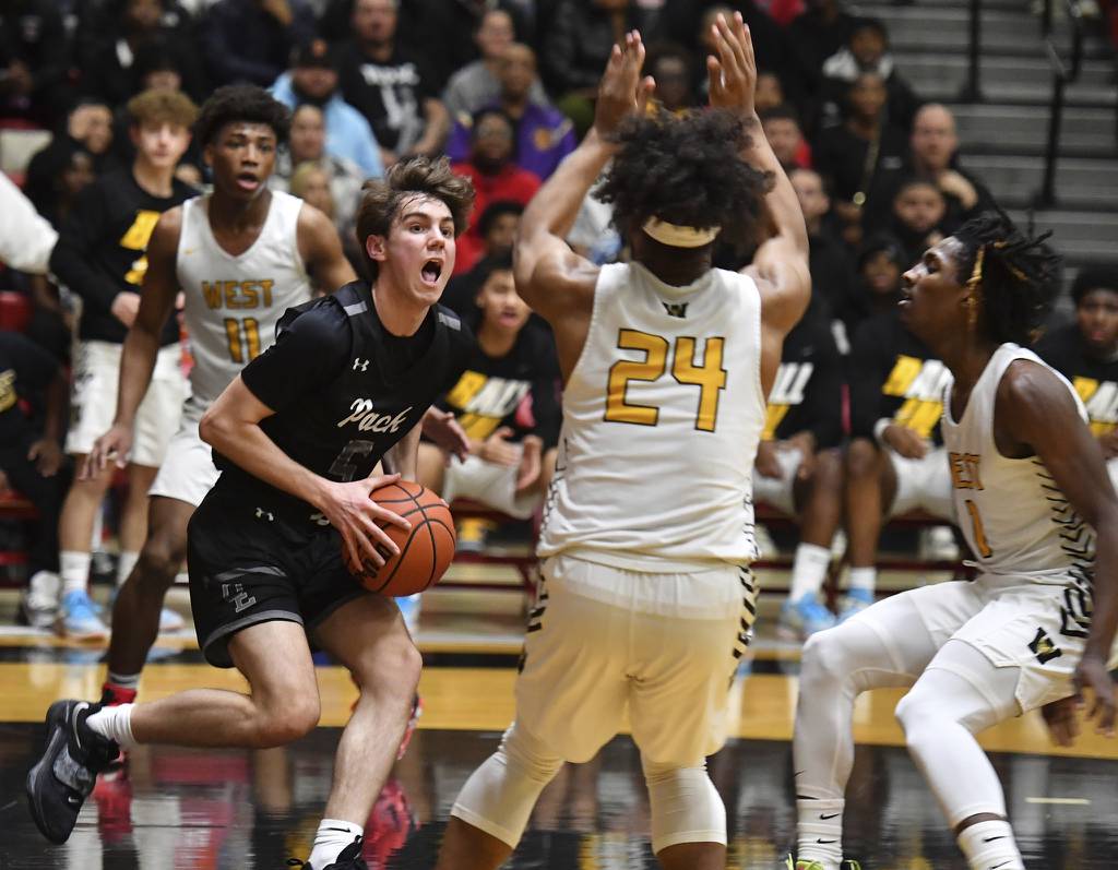Oswego East's Mason Blanco drives to the basket against Joliet West during the Class 4A Bolingbrook Sectional championship game on Friday, March 3, 2023.