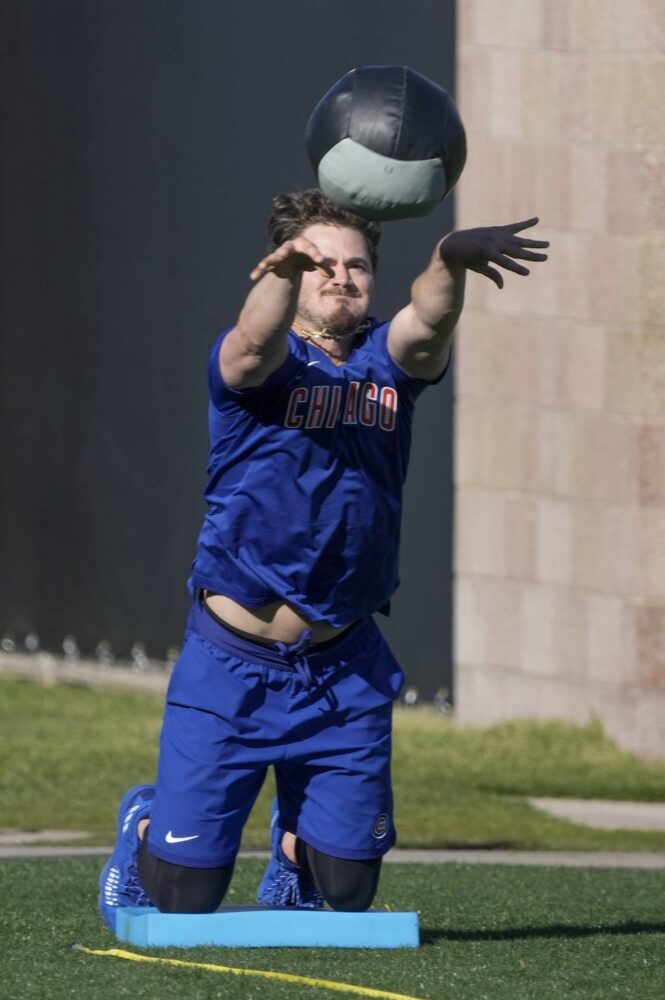 Zach McKinstry warms up during a Cubs spring training workout on Feb. 15, 2023.