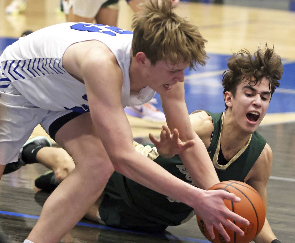 Burlington Central's Jake Johnson (23) battles Rockford Boylan's Aedan Campos (4) for control during a Class 3A Burlington Central Sectional semifinal game on Wednesday, March 1, 2023.