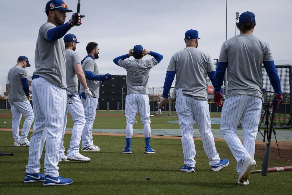 Cubs players prepare to take batting practice before the Cubs’ preseason opener at Sloan Field in Mesa, Arizona on Feb. 25, 2023.  
