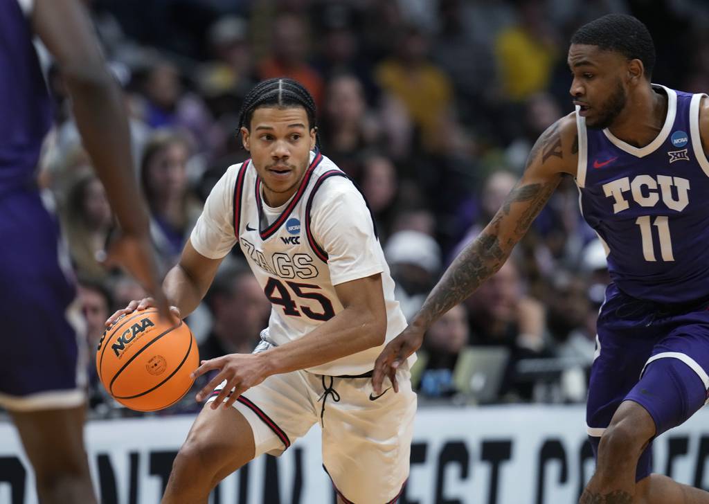 Gonzaga guard Rasir Bolton picks up a loose ball as TCU guard Rondel Walker defends in the second half of a second-round game on March 19, 2023.