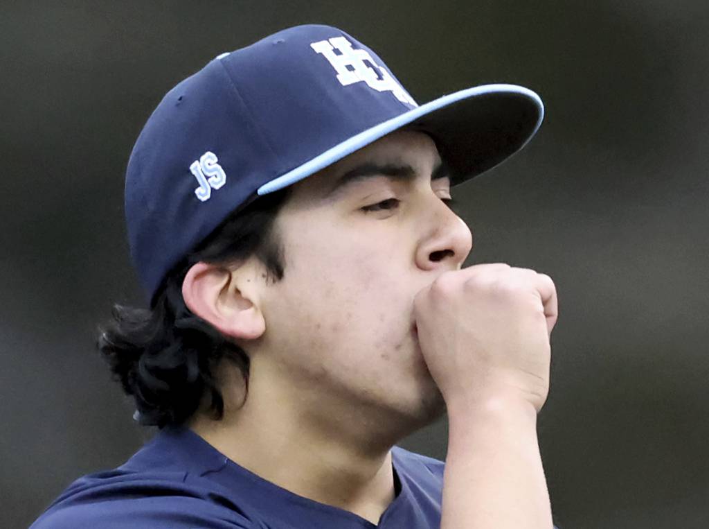 Harvest Christian's Jared Rodriguez (38) warms his pitching hand before facing Kaneland during a nonconference game at Judson's Hoffer Field in Elgin on Tuesday, March 21, 2023.