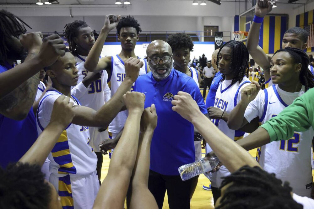 Simeon Career Academy varsity basketball head coach Robert Smith talks to his players during a break in a game against Gwendolyn Brooks College Preparatory Academy at Simeon, Jan. 24, 2023. Coach Smith got his 500th career win. 
