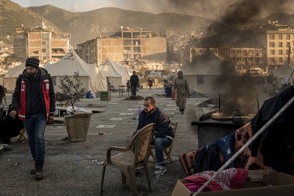 Displaced residents at a tent camp established in downtown Antakya, Turkey, on Feb. 15, 2023. Rescue efforts were still underway in hundreds of buildings for survivors of the magnitude-7.8 earthquake and its aftershocks. 
