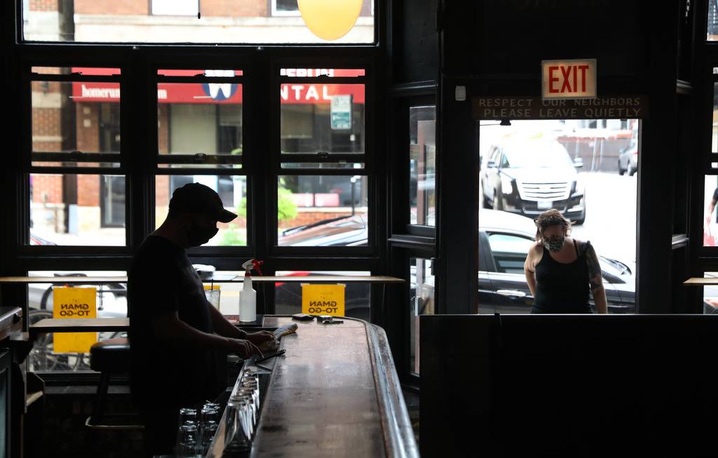Gman Tavern manager Tom Cathcart waits for carry-out customers on Aug. 1, 2020.  