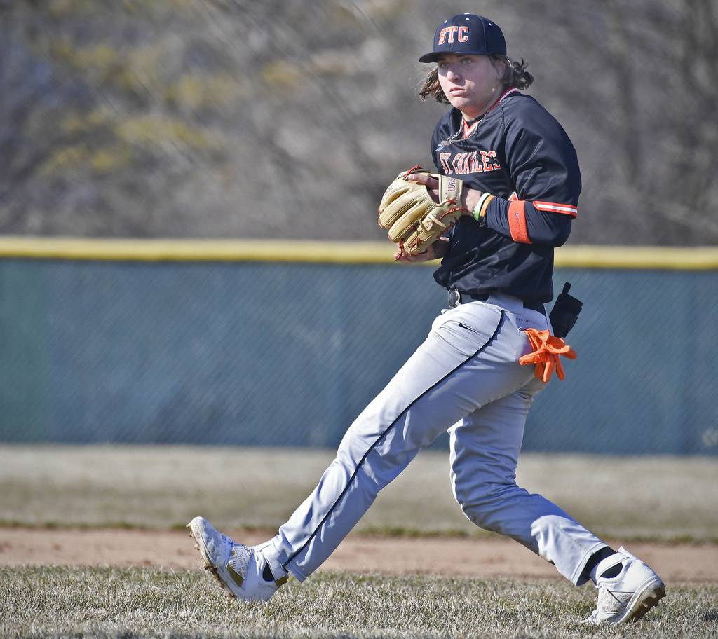 St. Charles East's Jake Zitella pivots toward home plate after taking a relay throw from the outfield against Waubonsie Valley during a nonconference game in Aurora on Monday, March 27, 2023.