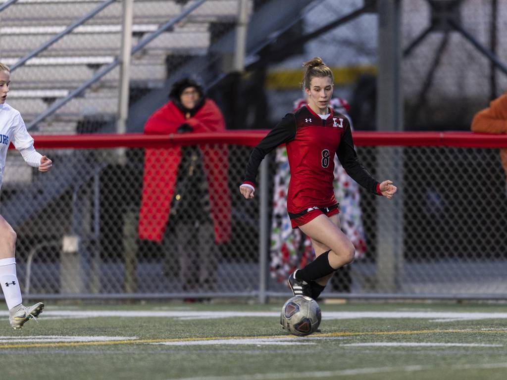 Marist's Alexis Shackelford, right, brings the ball up the field against Sandburg during a nonconference game in Chicago on Monday, March 27, 2023.
