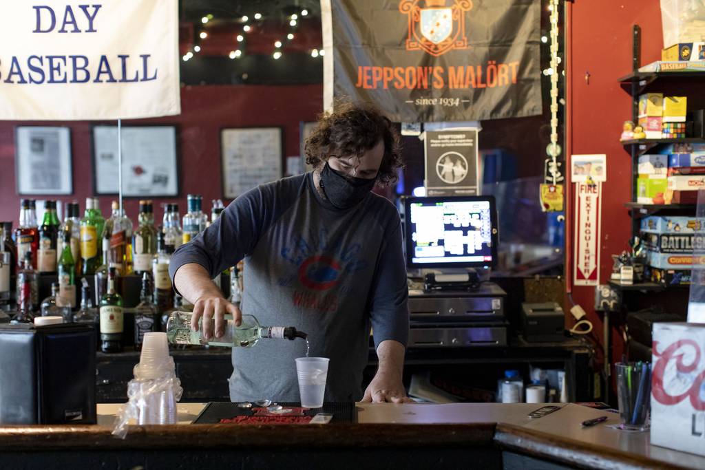 Bartender Jeff Gorski pours a drink at Nisei Lounge on March 30, 2021, in Wrigleyville.