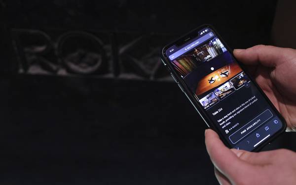 Roka Akor general manager Billy Pyroulis displays the reservation app Tablz, Feb. 18, 2023.