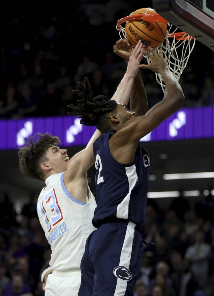 Northwestern guard Brooks Barnhizer (13) commits a foul while trying to block a shot by Penn State guard Evan Mahaffey (12) in overtime on March 1, 2023, at Welsh-Ryan Arena in Evanston.