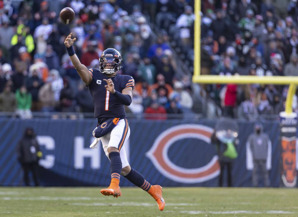 Bears quarterback Justin Fields throws a touchdown pass in the fourth quarter against the Eagles on Dec. 18, 2022, at Soldier Field.