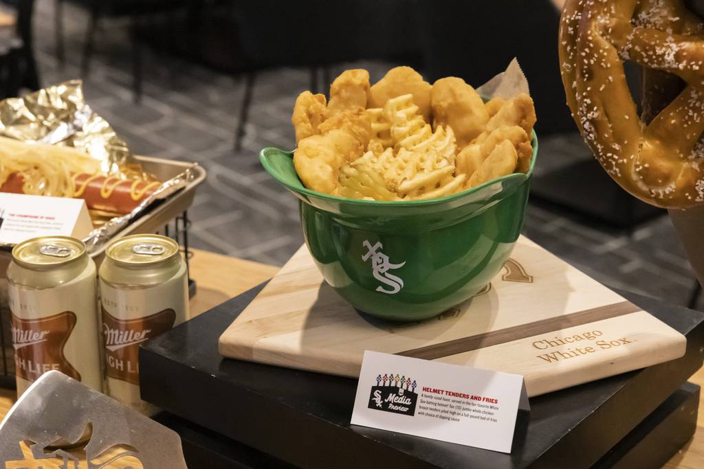 Served in a White Sox batting helmet, 10 jumbo whole chicken breast tenders are piled alongside a full-pound bed of fries at Guaranteed Rate Field. 