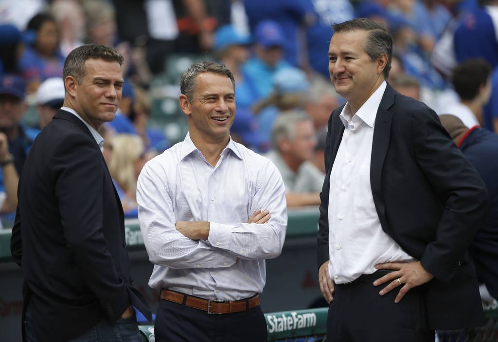Then-Cubs President Theo Epstein, left, general manager Jed Hoyer, center, and Chairman Tom Ricketts talk on Sept. 23, 2016, at Wrigley Field.