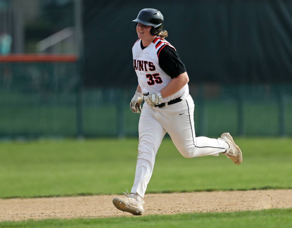 St. Charles East's James Brennan (35) rounds the bases hitting a home run against Batavia during a DuKane Conference game in St. Charles on Wednesday, May 11, 2022.
