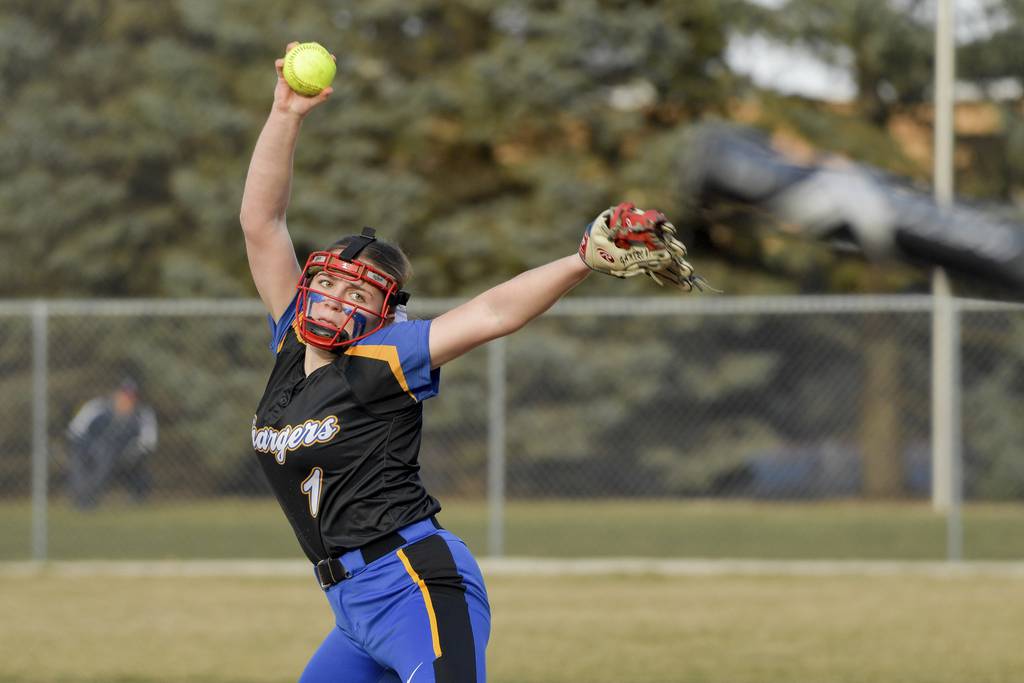 Aurora Central Catholic's Kate Gambro (1) delivers a pitch in a nonconference game at West Aurora on Monday, March 20, 2023.