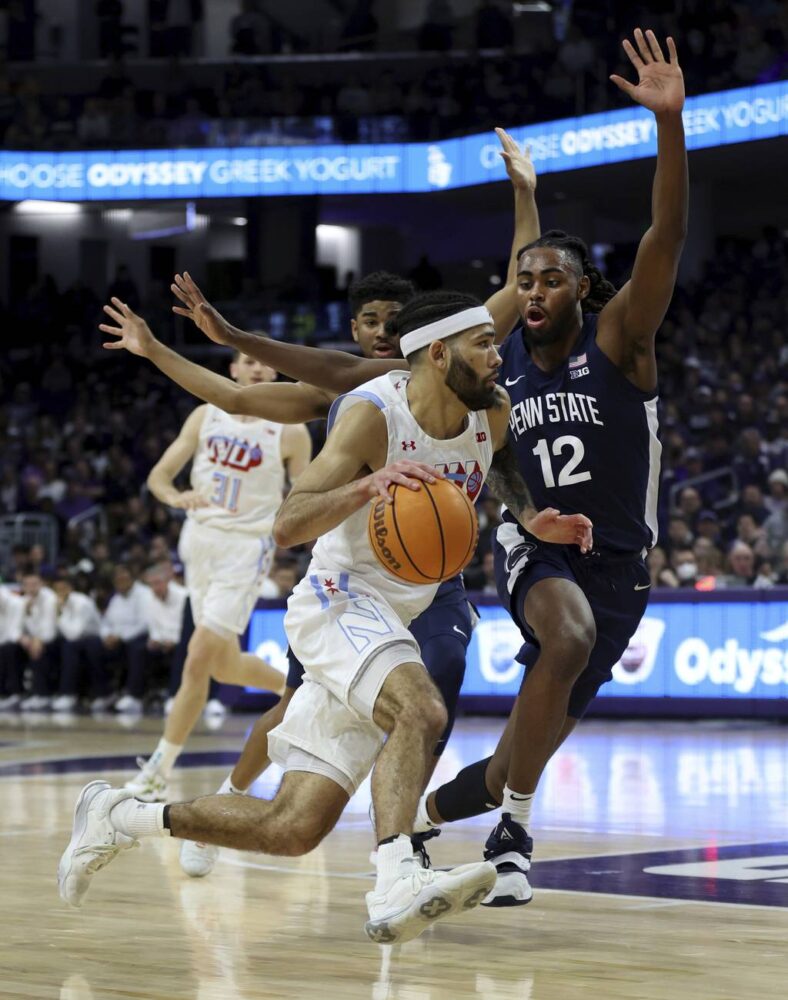 Northwestern guard Boo Buie (0) tries to drive around Penn State guard Evan Mahaffey (12) in the first half on March 1, 2023, at Welsh-Ryan Arena in Evanston.