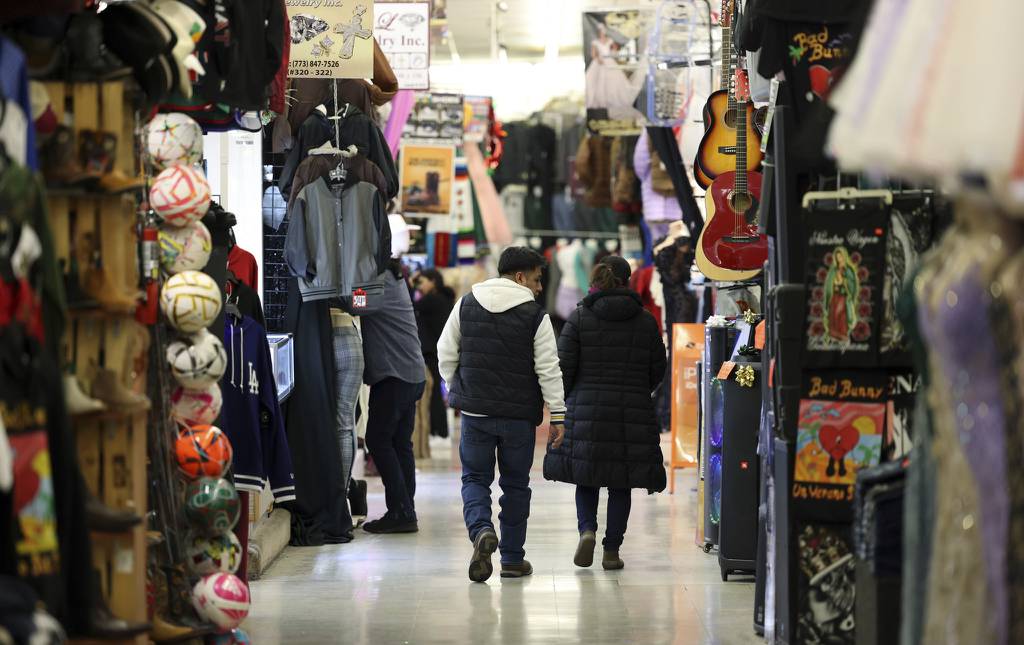 Two people walk through the aisles at the Little Village Discount Mall on Jan. 5, 2023, in Chicago.