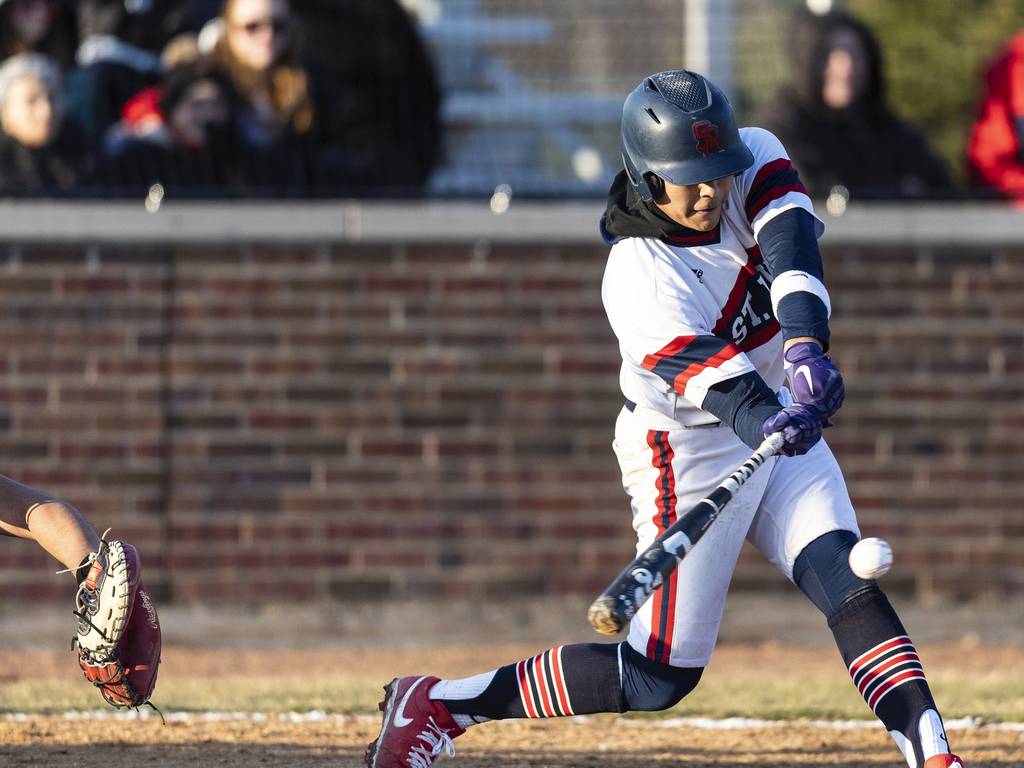 St. Rita’s Omar Alday connects on a pitch to drive in the go-ahead run against De La Salle during a Catholic League crossover in Chicago on Tuesday, March 28, 2023.