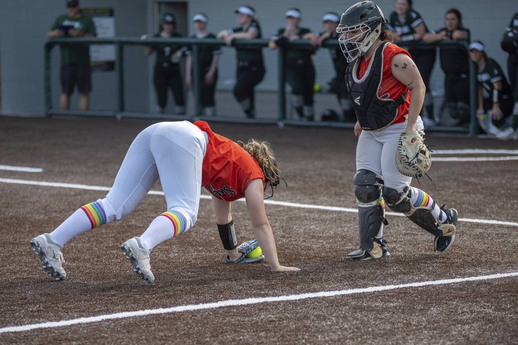Shepard’s Sarah Kreamalmeyer races in from third base to make a diving grab on a bunt against Evergreen Park during a South Suburban Red game on Monday, May 9, 2022.