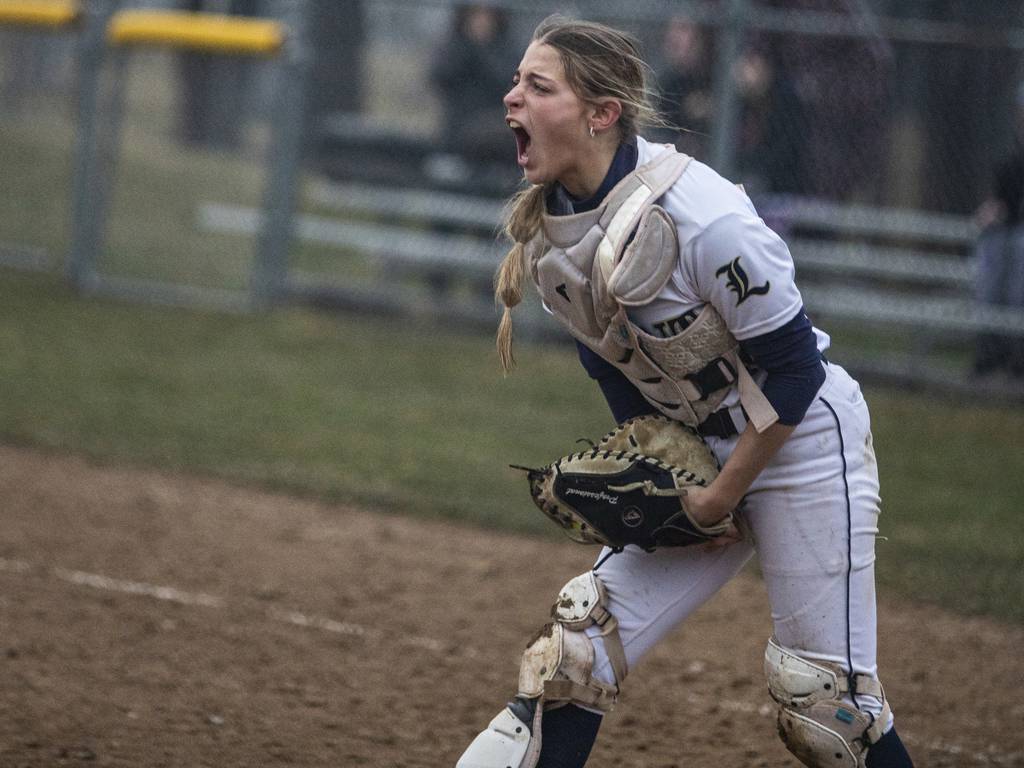 Lemont’s Frankie Rita (24) screams with excitement after tagging out Marist’s Eleen Donahue at the plate to end the nonconference game in Chicago on Wednesday, March 22, 2023.
