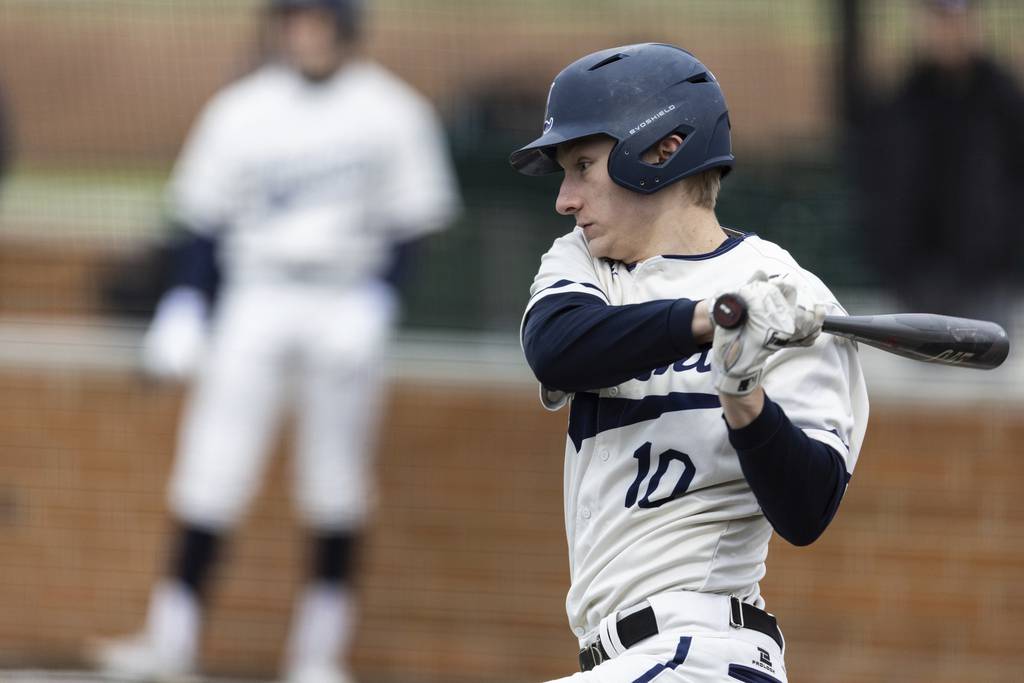 Lemont’s Luke Wallace (10) connects on a pitch against Evergreen Park during a South Suburban Conference crossover in Evergreen Park on Tuesday, March 21, 2023.