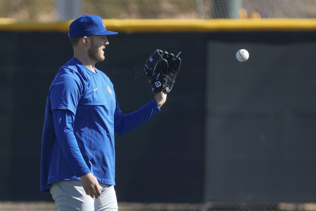 Jameson Taillon catches a ball during a Cubs spring training workout on Feb. 15, 2023.
