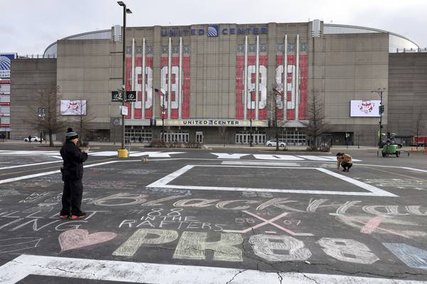 Former Blackhawks player Patrick Kane is honored with his number adorning the facade of the United Center and thank you messages created with chalk on March 2, 2023.
