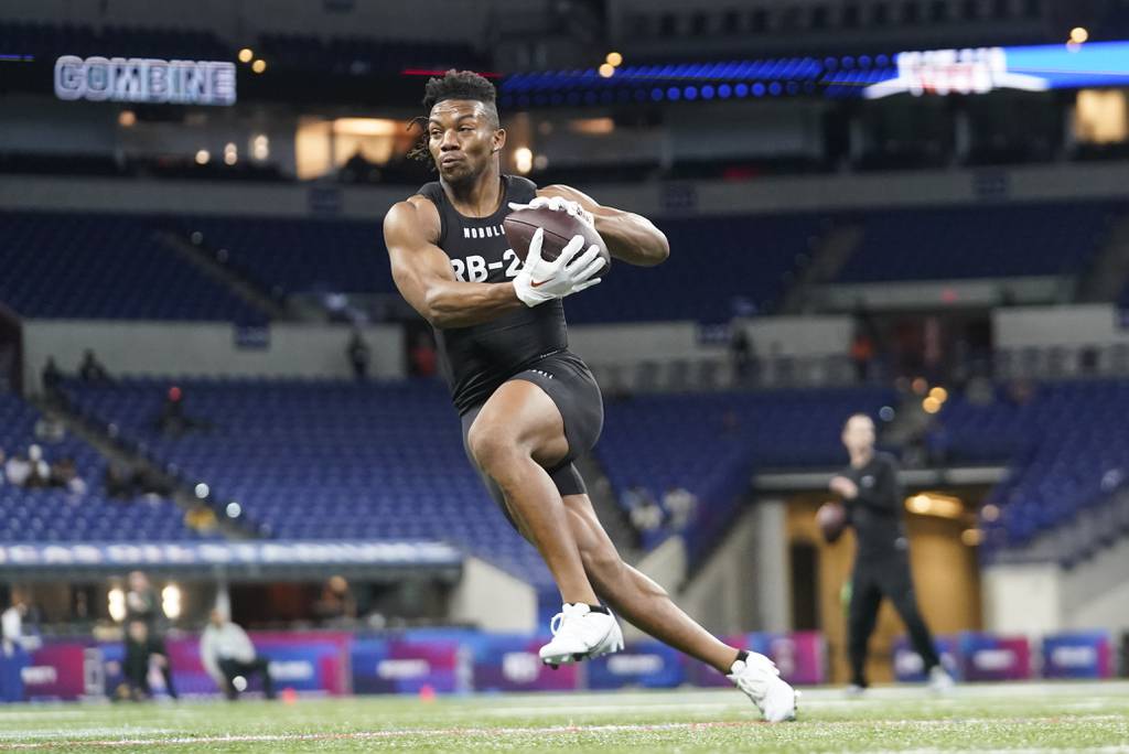 Texas running back Bijan Robinson runs a drill at the NFL combine on March 5, 2023.