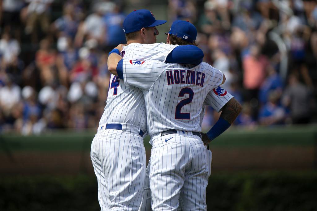 Cubs first baseman Anthony Rizzo (44) and shortstop Nico Hoerner share a hug during a game against the Diamondbacks on July 25, 2021, at Wrigley Field. 
