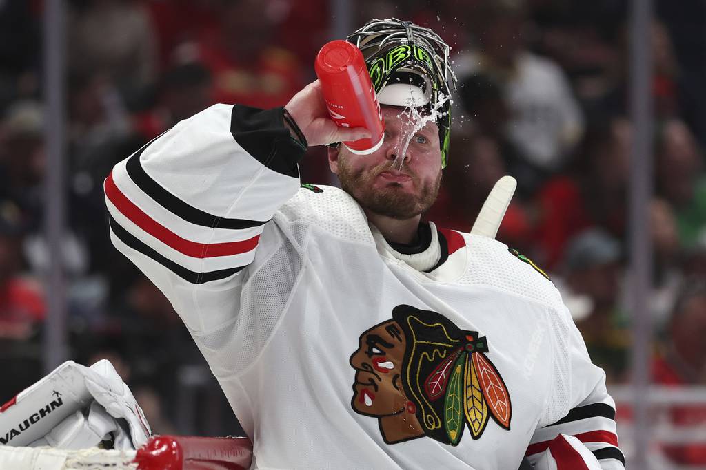 Blackhawks goalie Anton Khudobin spits out some water during the second period against the Capitals on Thursday in Washington. 