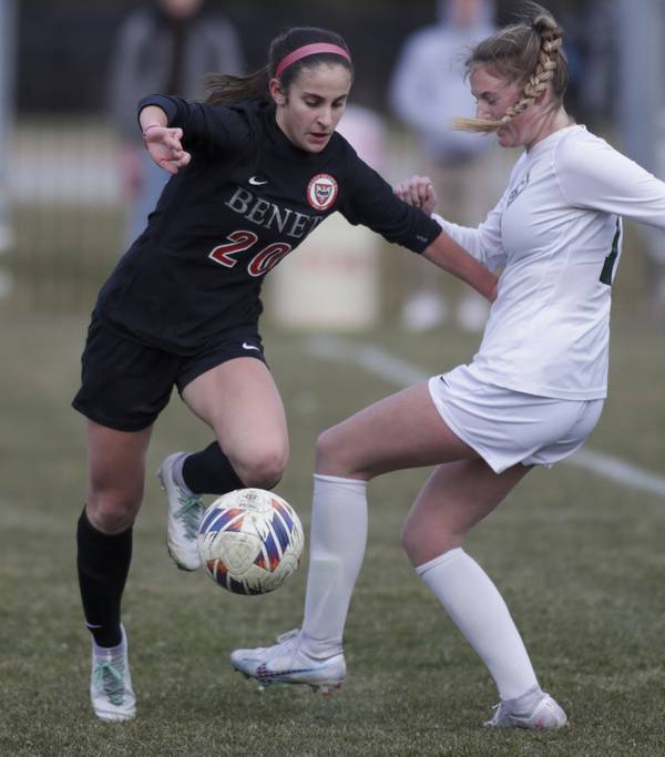 Benet’s Ivana Vukas (20) gets around Glenbard West’s Audrey Sawyer (11) during a game in Lisle on Tuesday, March 21, 2023. 