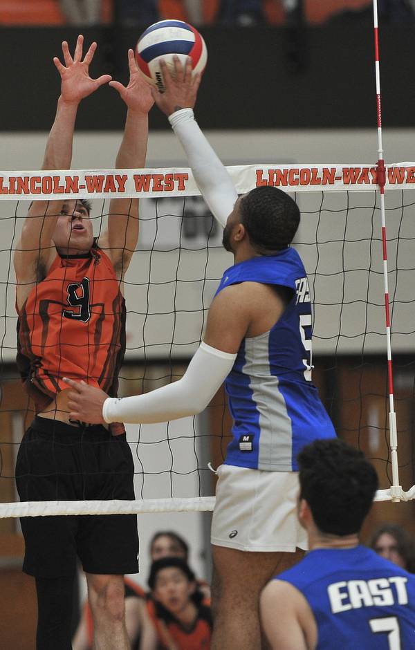 Lincoln-Way West's Connor Studer (9) tries to block a shot by Lincoln-Way East's Jared Byas during a SouthWest Suburban Conference match in New Lenox on Thursday, April 21, 2022.