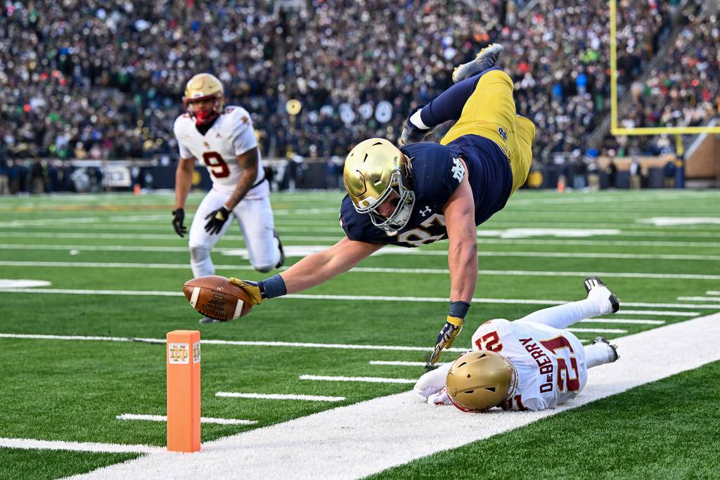 Notre Dames's Michael Mayer dives just short of a touchdown in the first half against Boston College's Josh DeBerry on Nov. 19, 2022.
