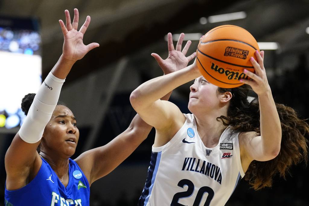 Villanova's Maddy Siegrist, right, looks to shoot against Florida Gulf Coast's Kierra Adams during the second half of a second-round game on March 20, 2023.