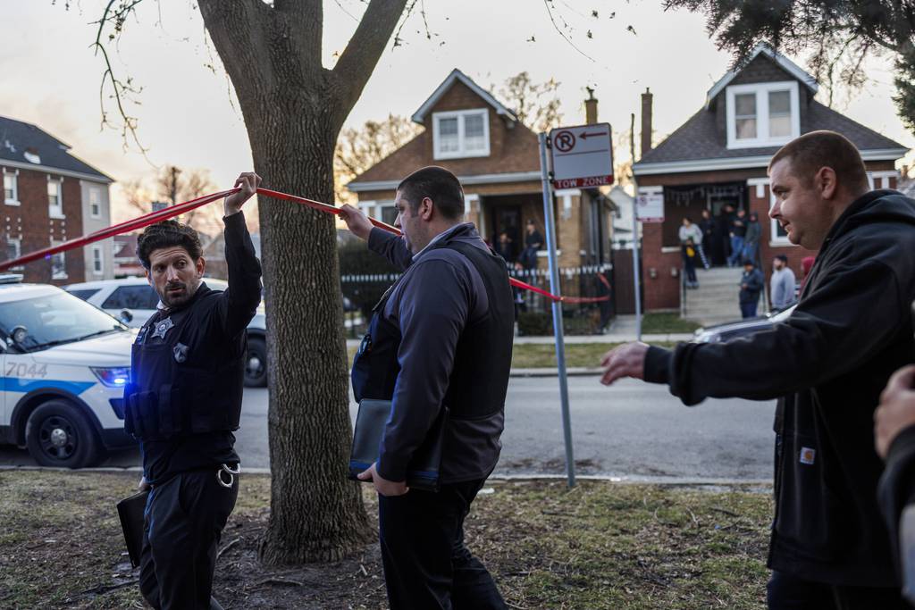Police work at the scene where an Chicago police Officer Andres Vasquez-Lasso was shot and killed near the 5200 block of South Spaulding Avenue in the city's Gage Park neighborhood on March 1, 2023.