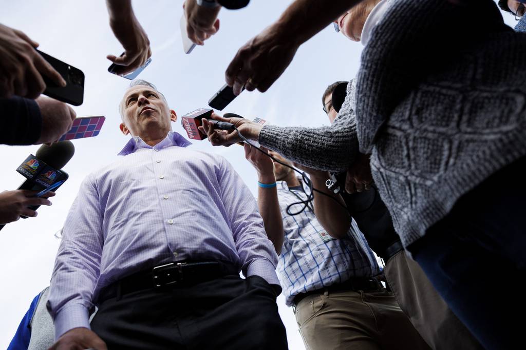 Cubs President Jed Hoyer talks with reporters before a game against the Mariners on April 11 at Wrigley Field. 