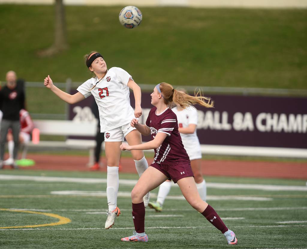 Lincoln-Way Central's Lila Hadley (27) heads the ball against Lockport during a SouthWest Suburban Conference crossover in Lockport on Tuesday, April 4, 2023.