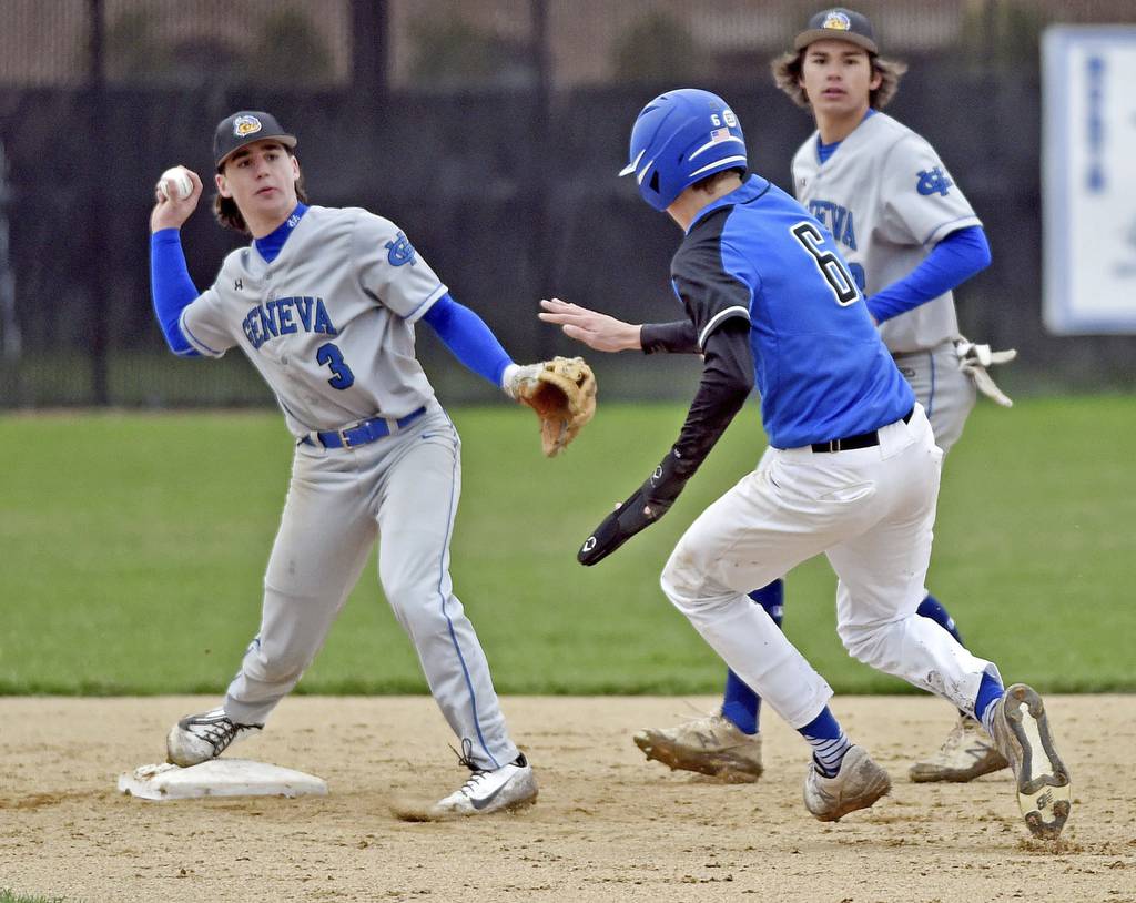 Geneva's Nate Stempowski forces St. Charles North's Parker Reinke at second and throws to first on a double play attempt during a DuKane Conference game in St. Charles on Monday, April 25, 2022.
