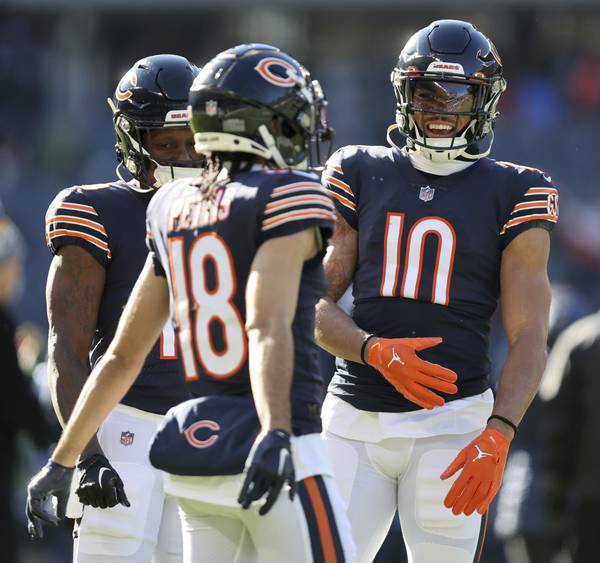 Bears wide receiver Chase Claypool (10) has a laugh with some of his teammates before a game against the Packers on Dec. 4, 2022, at Soldier Field.