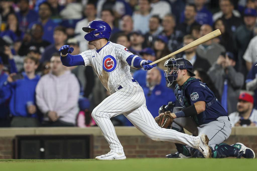 Nico Hoerner hits a walk off RBI single to give the Cubs a 3-2 win in the tenth inning against the Mariners at Wrigley Field on April 10, 2023.