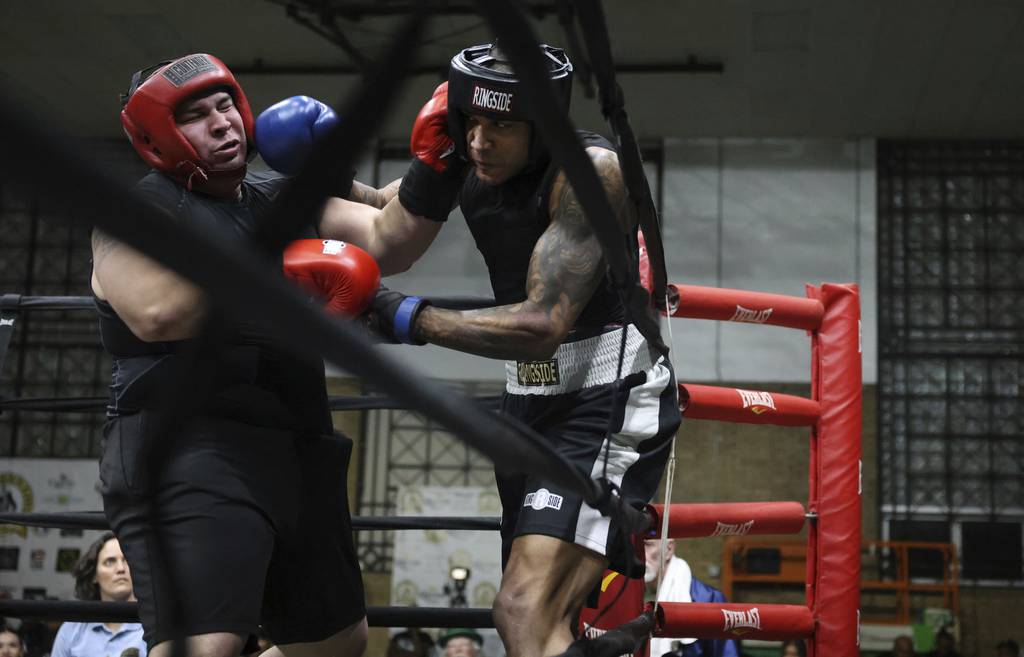 Eric Ross, right, battles Andres Merlos during a super heavyweight preliminary bout at the Chicago Golden Gloves boxing tournament at Cicero Stadium on March 10, 2023.  