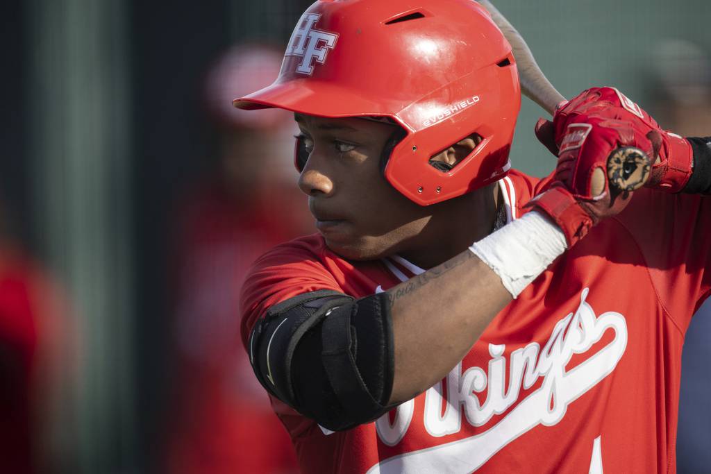 Homewood-Flossmoor's Dillon Head (1) gets to ready to swing against Andrew during a SouthWest Suburban Conference crossover in Flossmoor on Monday, April 10, 2023.