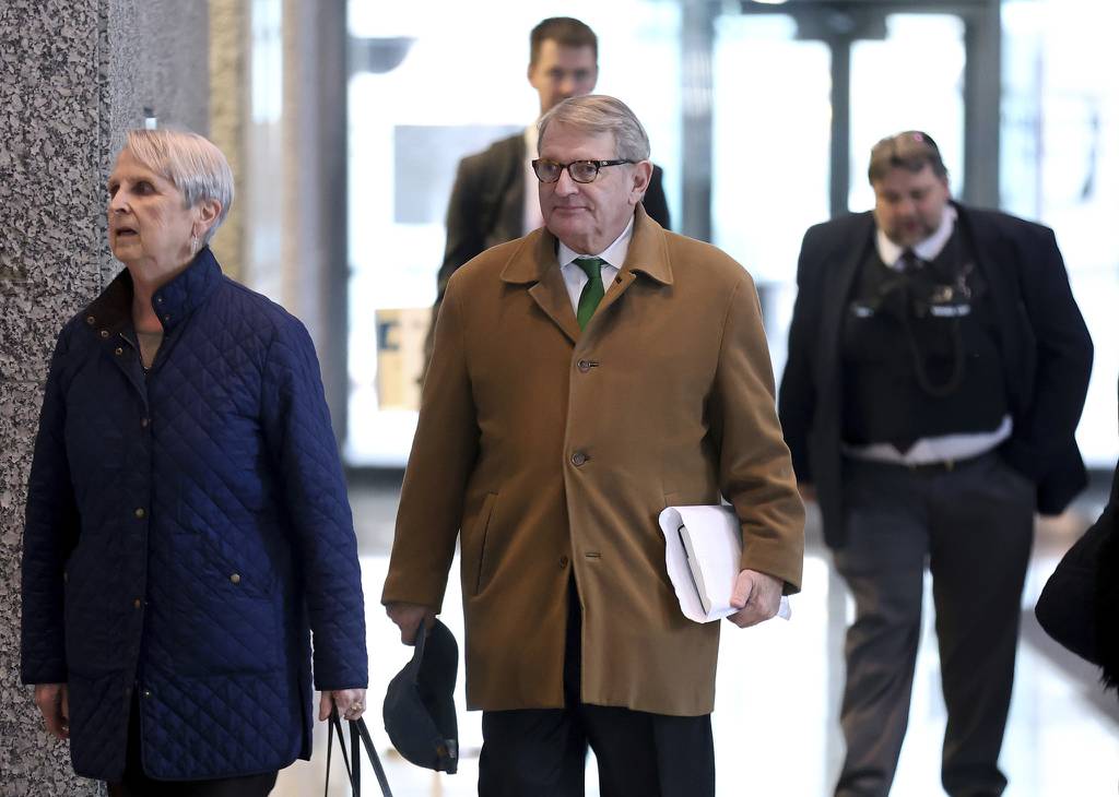 Defendant Michael McClain, center, exits the Dirksen U.S. Courthouse in downtown Chicago on March 28, 2023. 