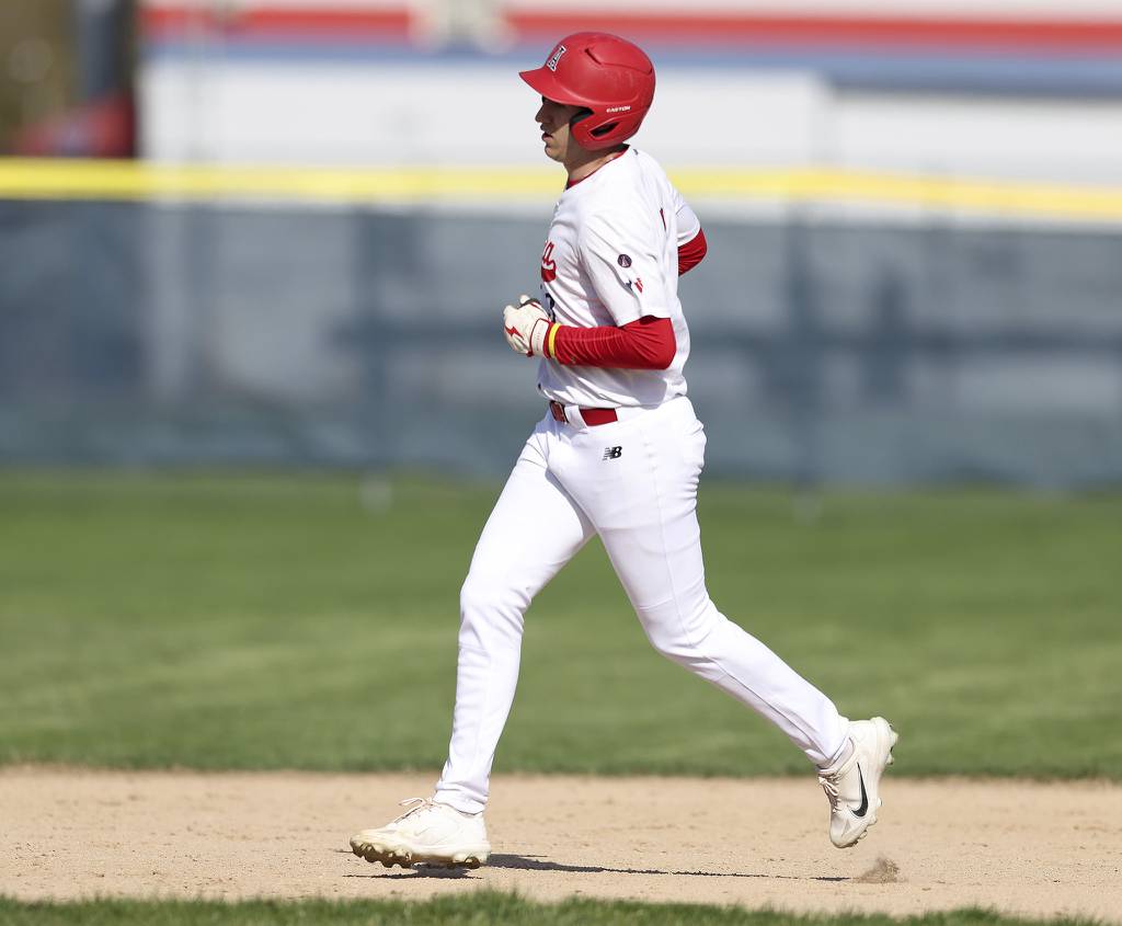 West Aurora's Ryan Niedzwiedz (3) rounds the bases after hitting a home run against Oswego East during a Southwest Prairie West game on Tuesday, April 18, 2023.