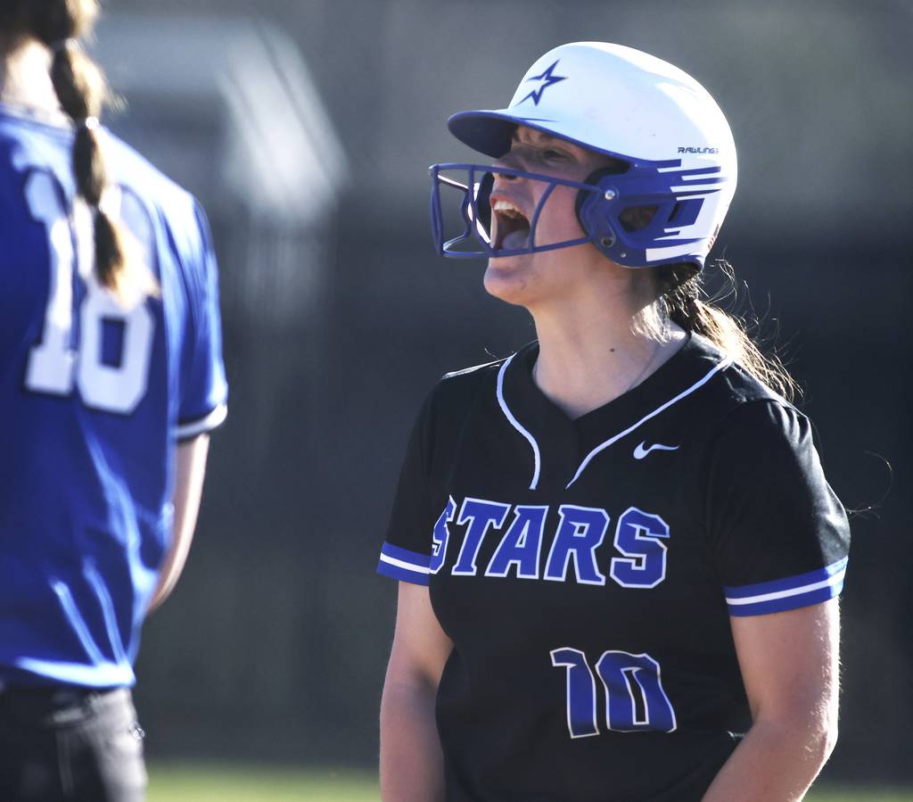 St. Charles North's Sophia Olman (10) lets out a yell after driving in a run with a single against Lincoln-Way East during a nonconference game on Wednesday, April 12, 2023.
