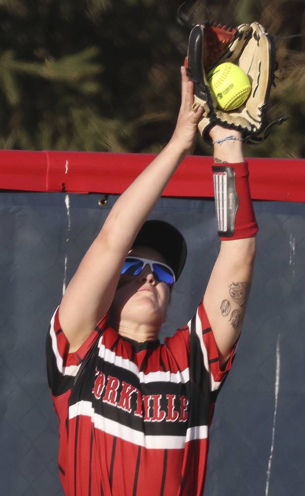 Yorkville's Kaitlyn Roberts (8) catches a ball on the warning track for an out against West Aurora during a Southwest Prairie conference game in Aurora on Thursday, April 13, 2023.