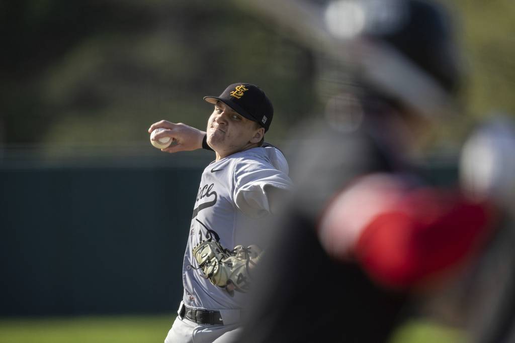 St. Laurence's Kannen Mosher (13) delivers a pitch against Marist during a nonconference game in Chicago on Tuesday, April 18, 2023.