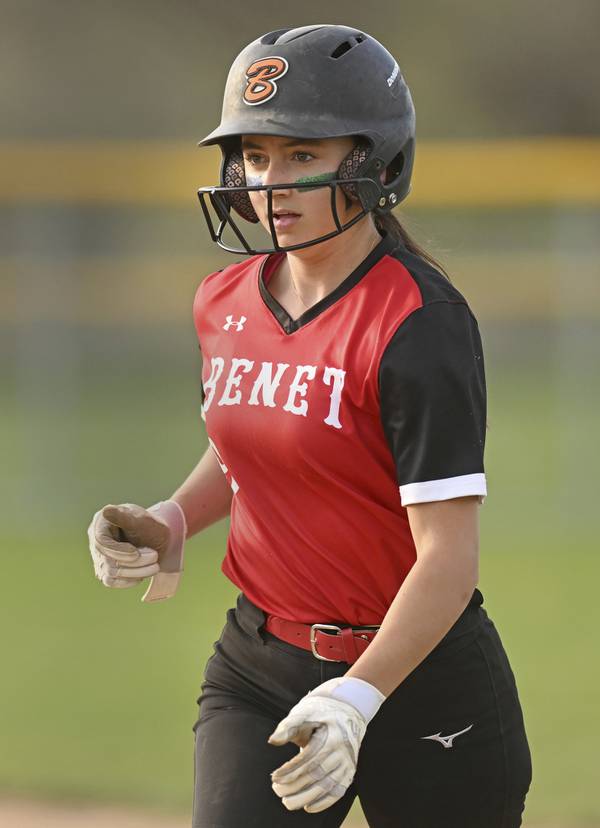 Benet’s Nina Pesare (9) returns to the bench after a sacrifice bunt during a game against Waubonsie Valley in Aurora on Friday, April 14, 2023.