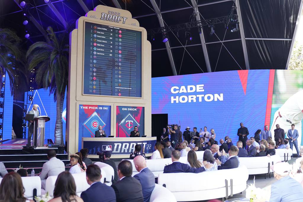 MLB Commissioner Rob Manfred, left, announces the Cubs' selection of Cade Horton with the seventh pick of the 2022 draft on July 17, 2022, in Los Angeles. 